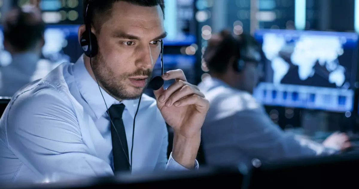 Male employee talking over headset