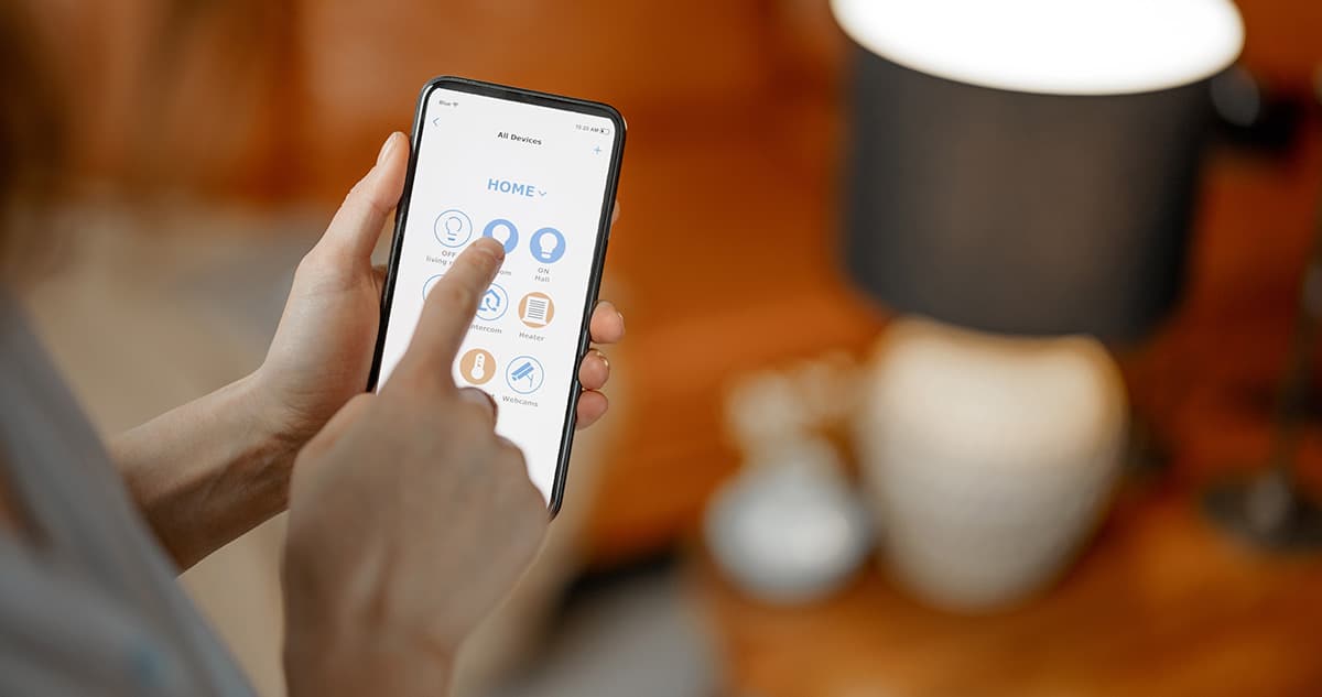 People looking at tablet. Tablet is enlarged to show commercial security solutions