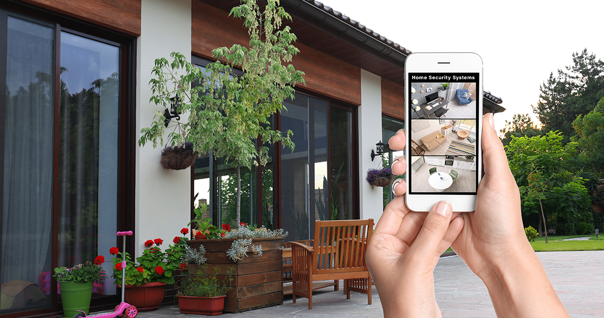 People looking at tablet. Tablet is enlarged to show commercial security solutions